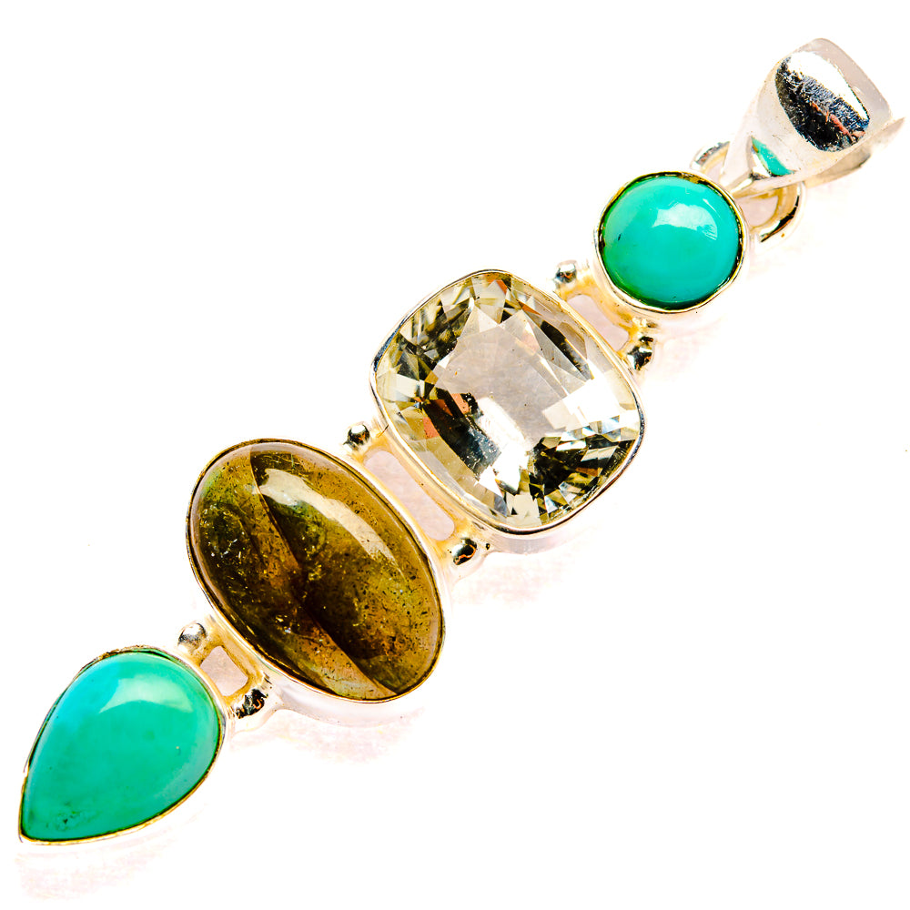 Gemstone pendant showing green oval cabochons and clear round-cut center in silver