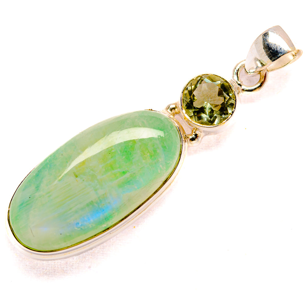 Oval green gemstone pendant with round green stone accents, silver-tone setting