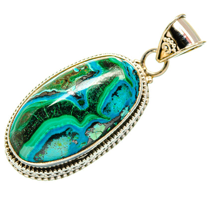 Oval chrysocolla-and-malachite pendant in silver setting with loop bail, green-blue stone