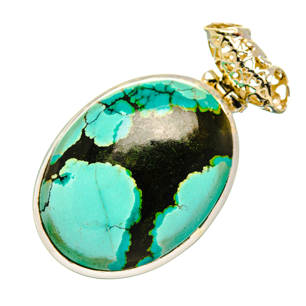 Oval turquoise pendant with black matrix, silver bezel and decorative bail
