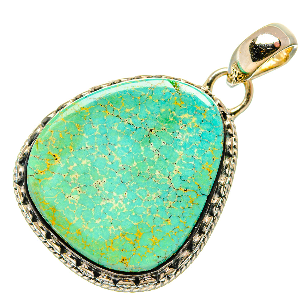 Oval turquoise cabochon pendant in textured 925 sterling silver frame with bail