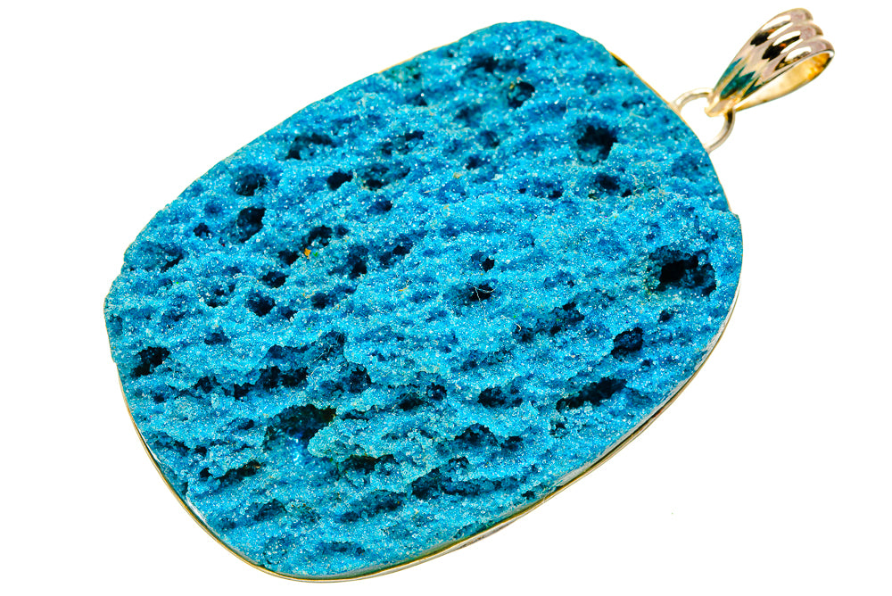 Blue druzy pendant with gold-tone bezel and bail, teardrop slice shape