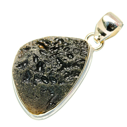 Tektite pendant with textured black stone teardrop frame and bail, sterling silver