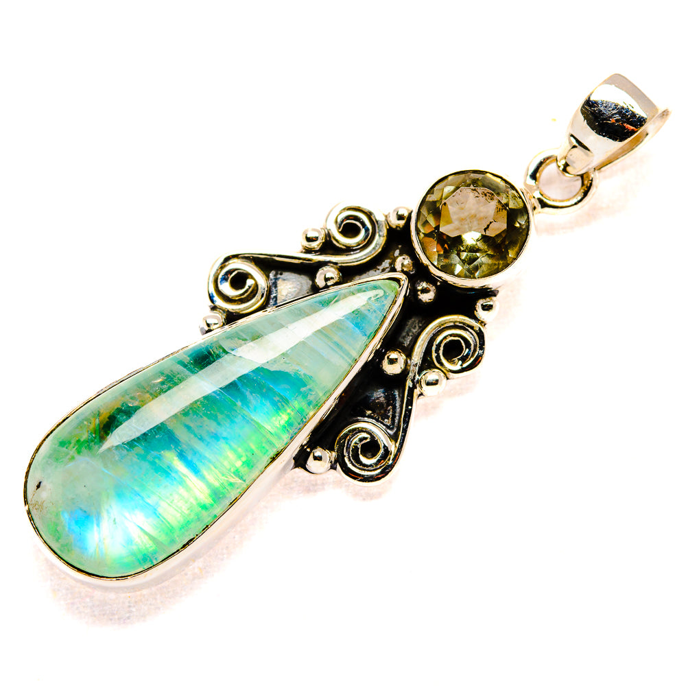 Sterling silver pendant featuring green opal teardrop, round green crystal, detailed filigree