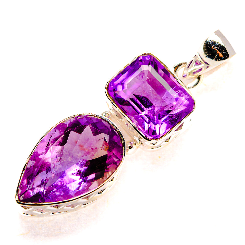 Sterling silver amethyst pendant with faceted teardrop and cushion-cut stones