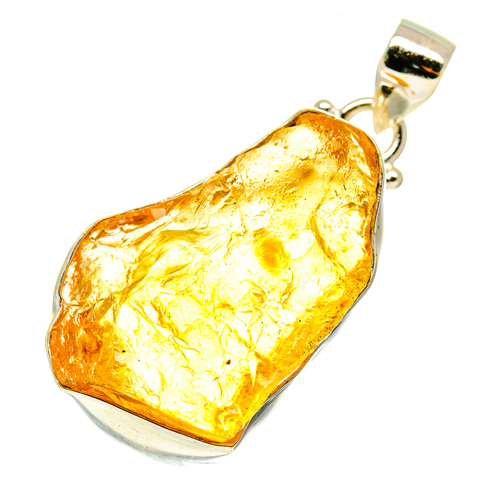 Rough citrine pendant with sterling silver bail, irregular amber-gold stone.