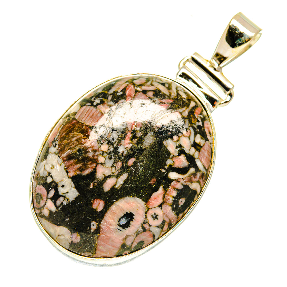 Sterling silver oval fossil pendant with colorful speckled black, pink, and cream cabochon.