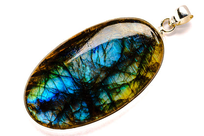 Oval labradorite pendant with blue-green flash set in silver frame, bail loop
