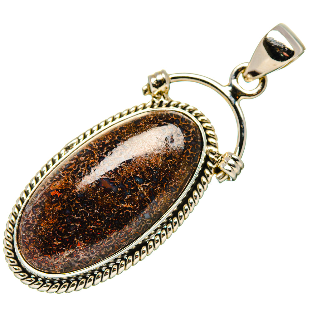 Oval dinosaur bone pendant in 925 sterling silver with textured bezel and bail