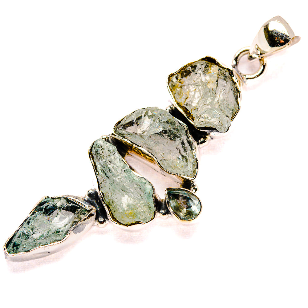 Rough aquamarine pendant with silver bezel-set gemstones and round top bail