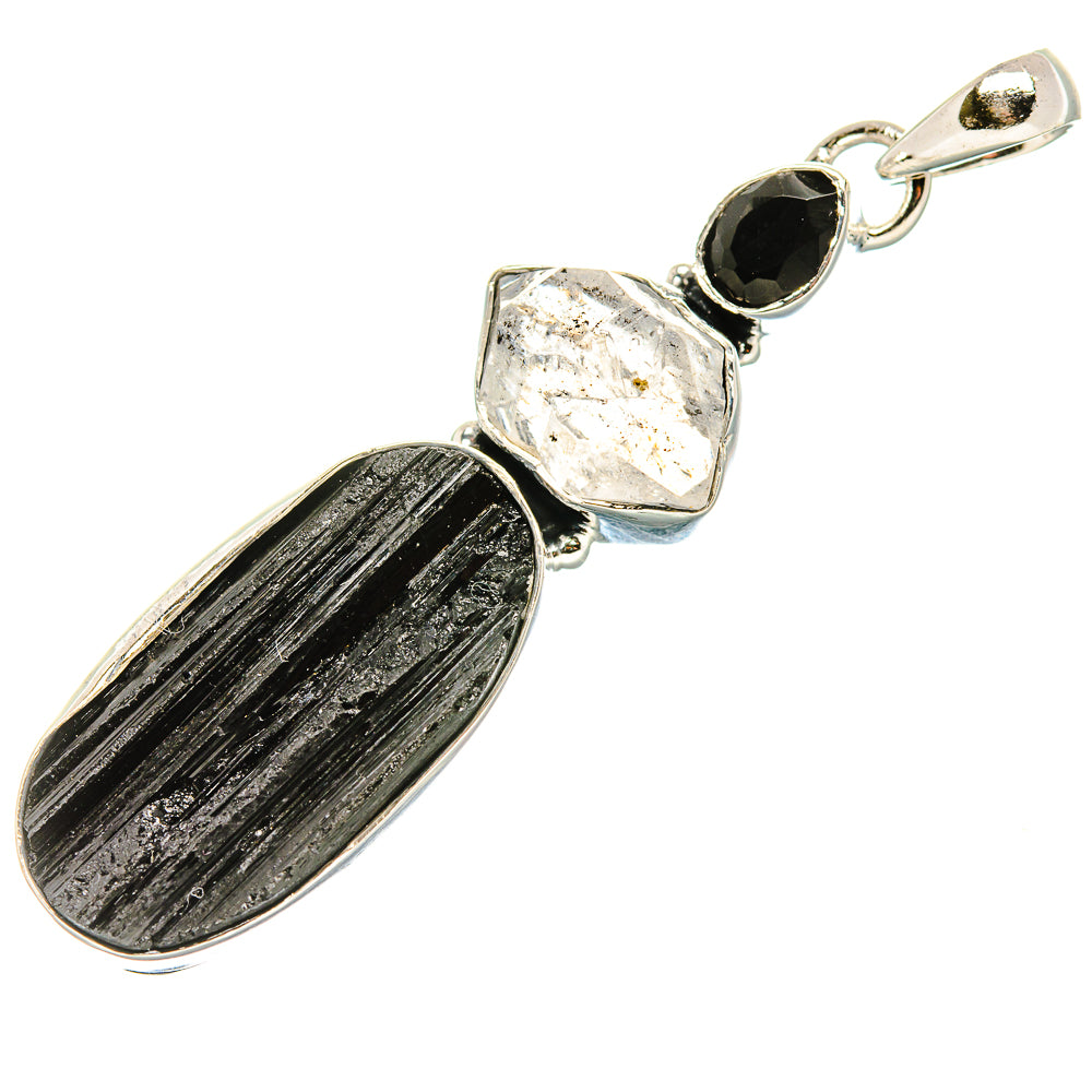 Sterling silver pendant with oval black onyx, rough clear crystal, and round black stone