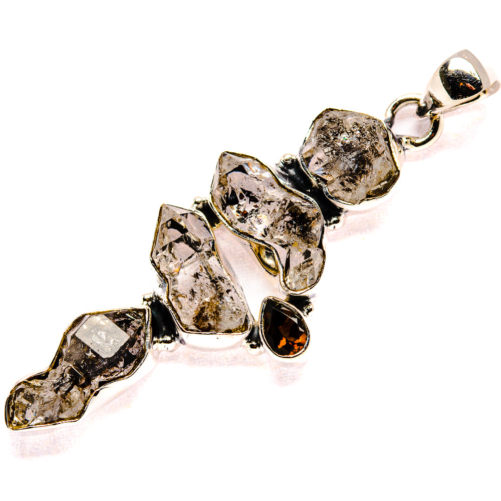 Sterling silver pendant with faceted smoky clear and dark red stones