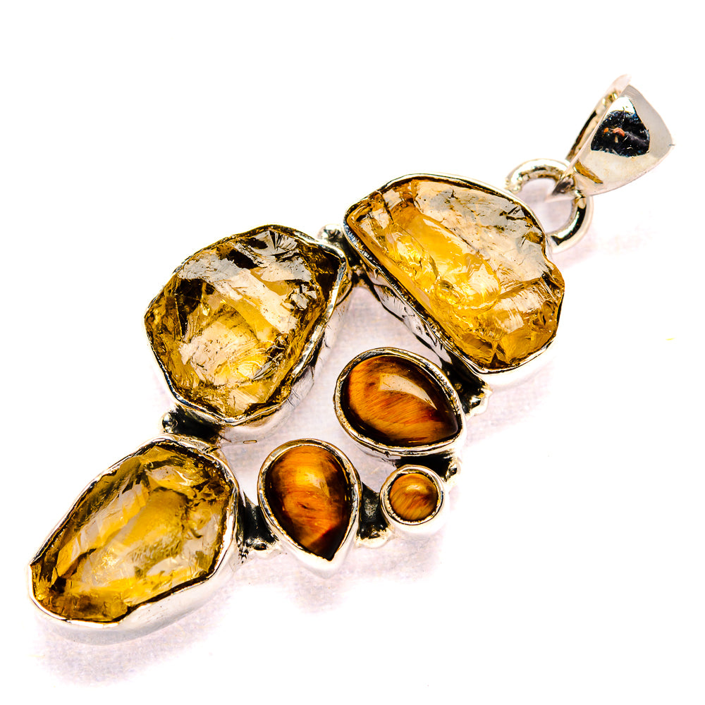 Sterling silver pendant with rough citrine and tiger eye cabochon stones