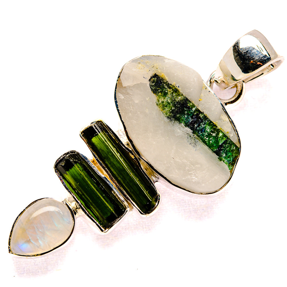 Sterling silver pendant with oval white quartz, green tourmaline bar, moonstone accent