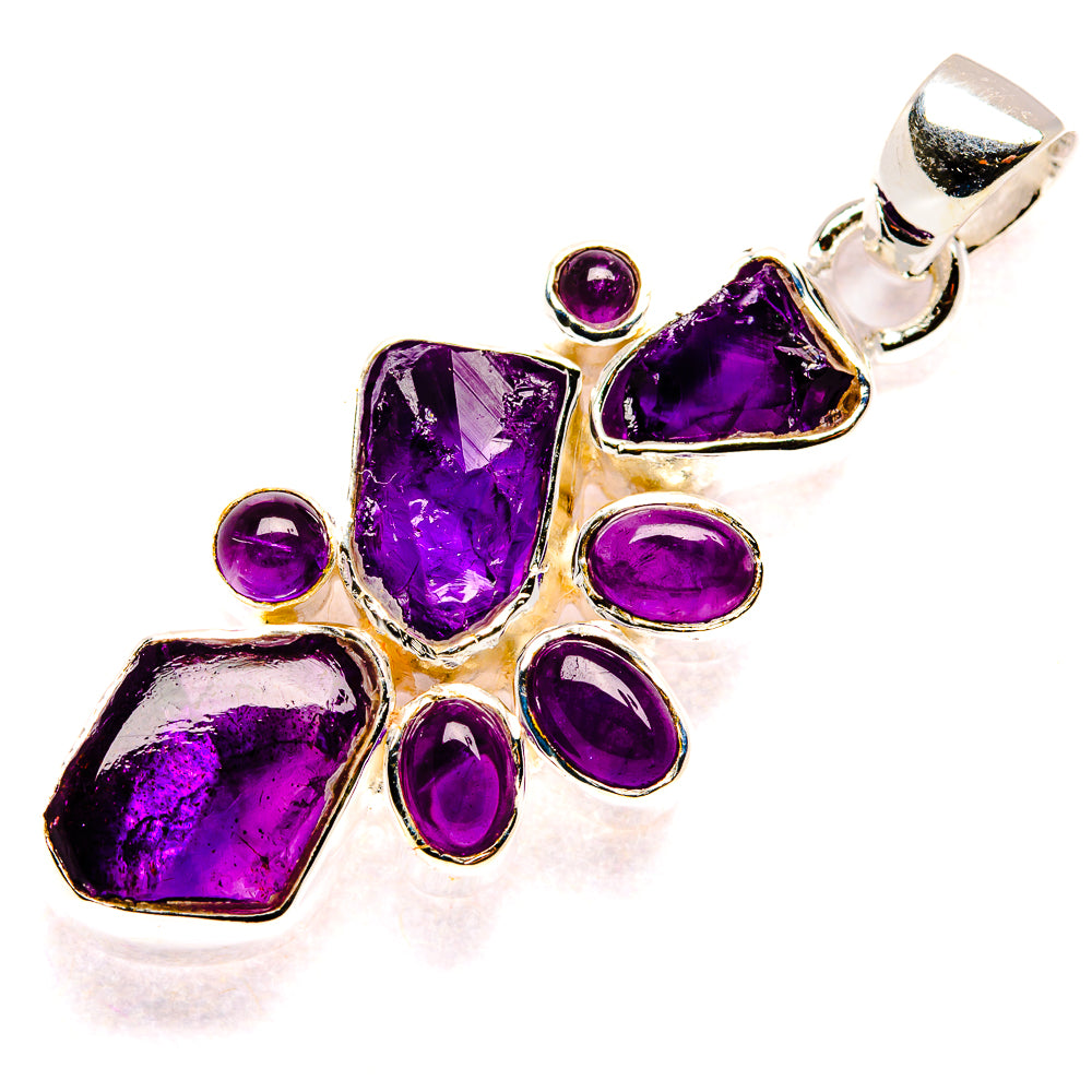 Sterling silver rough amethyst pendant with faceted purple stones and round accents