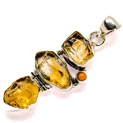 Sterling silver pendant with three rough yellow stones and small orange round charm