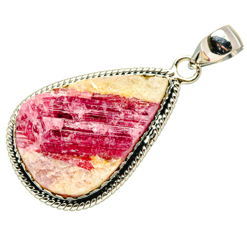 Sterling silver teardrop pendant with pink gemstone cabochon and rope border