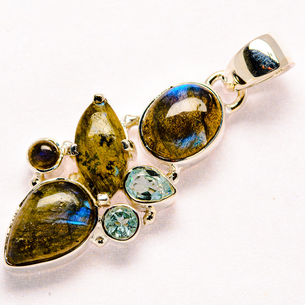 Sterling silver labradorite and blue topaz pendant with multiple faceted stones, oval settings
