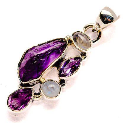 Silver pendant with rough amethyst purple stones and round iridescent moonstone cabochons