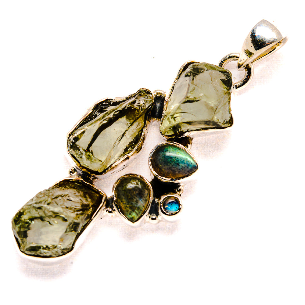 Rough gemstone pendant in 925 sterling silver with green facets and blue cabochon