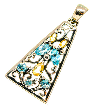 Rectangular sterling silver pendant with blue topaz and citrine gemstones, ornate filigree