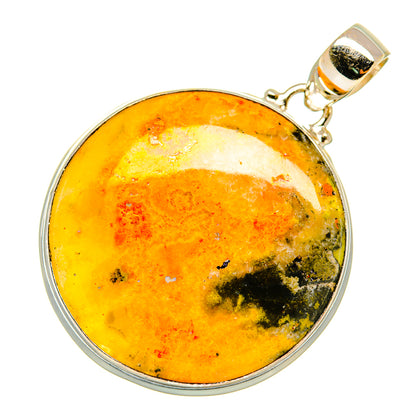 Round jasper pendant in sterling silver bezel with bright yellow stone and green patches