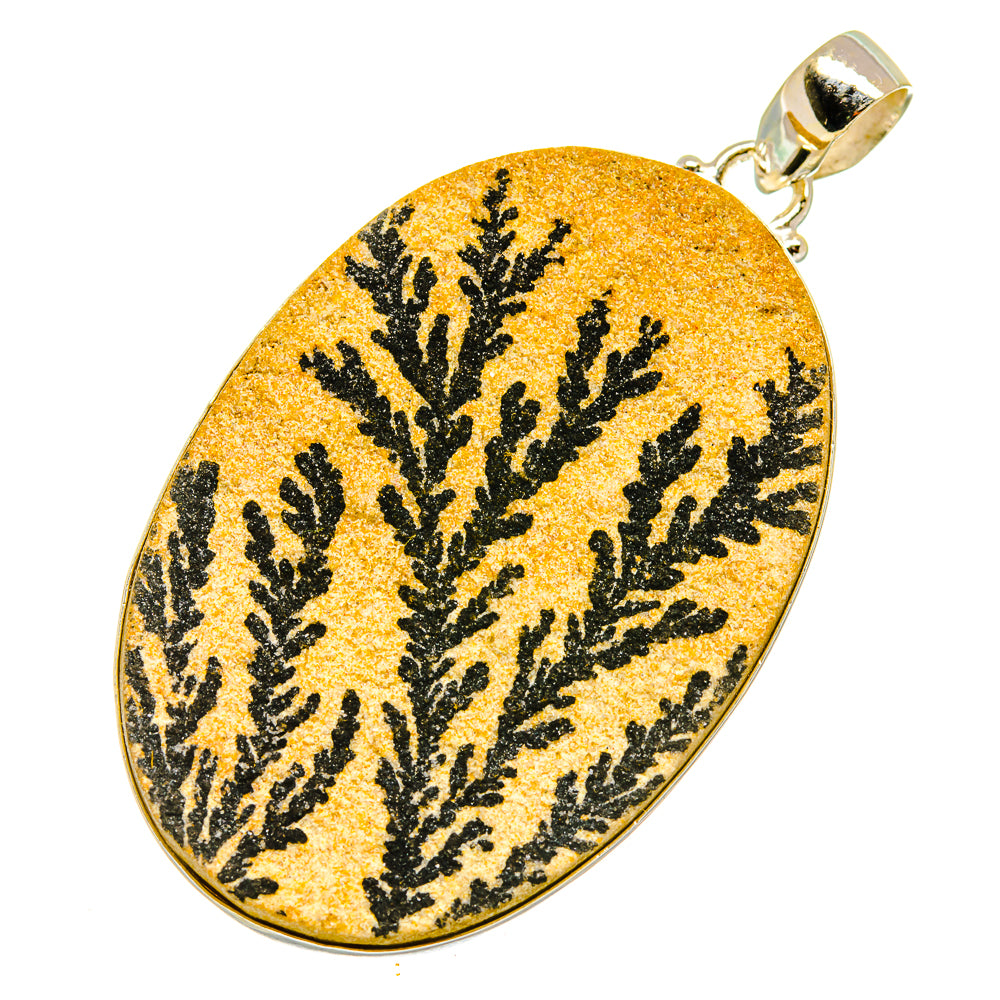Psilomelane dendrite pendant in oval, yellow with black tree-like pattern, silver bail