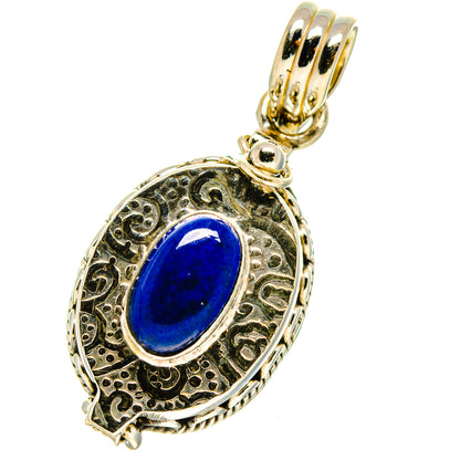Lapis lazuli pendant, oval blue gemstone in detailed gold-tone silver setting