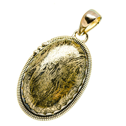Oval pyrite agate pendant in textured sterling silver bezel with gold-toned stone bail