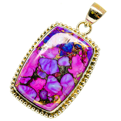 Gold-tone pendant with purple-blue turquoise stone, oval bezel and loop bail.