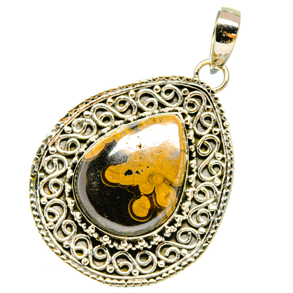 Sterling silver filigree teardrop pendant with black and yellow cabochon