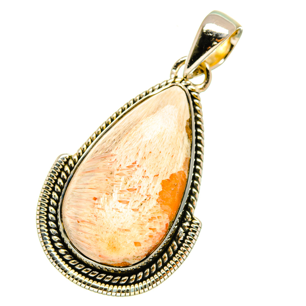 Scolecite teardrop pendant with gold-toned bail and ornate silver edging, peach stone
