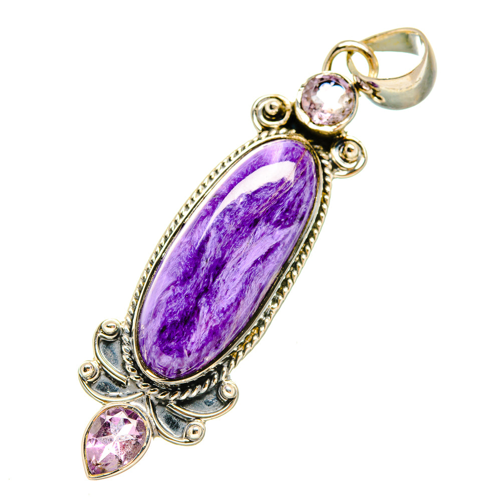 Amethyst and silver pendant with oval purple stone and round pink accents, top bail