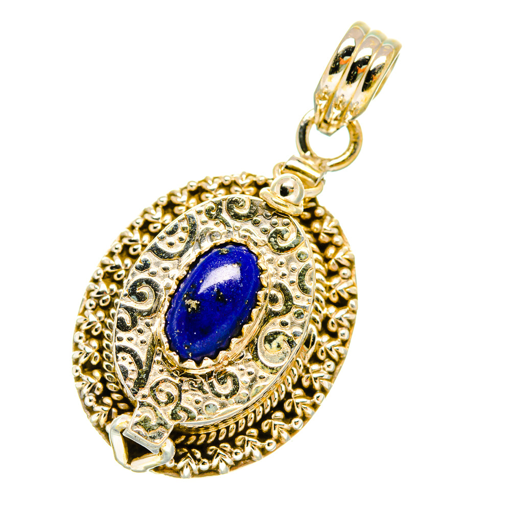 Gold-tone filigree poison pendant with blue lapis oval cabochon and hanging bail
