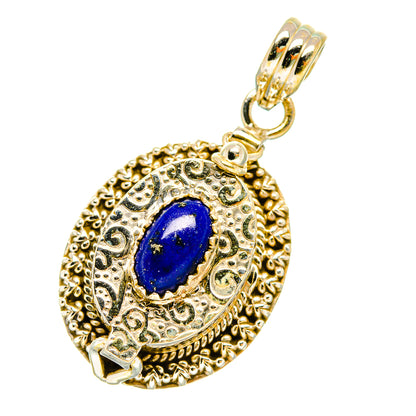 Gold-tone filigree poison pendant with blue lapis oval cabochon and hanging bail