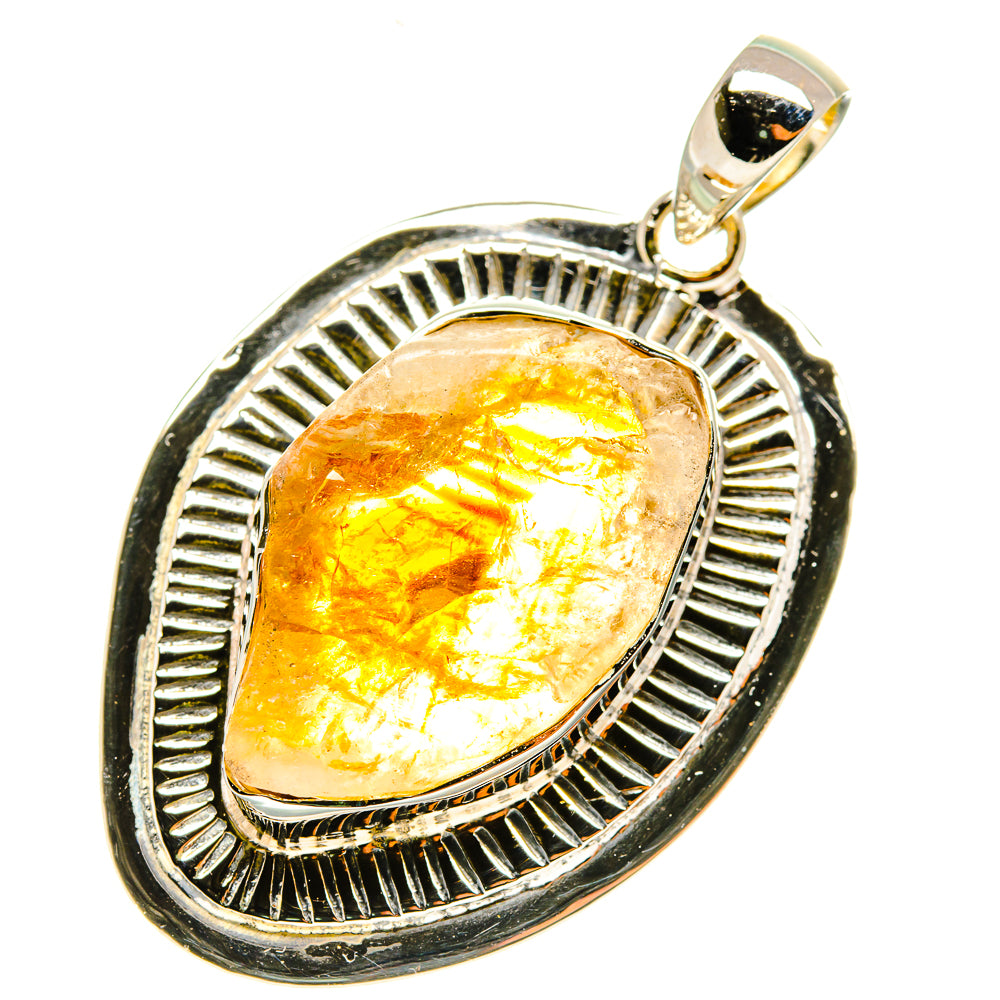 Rough citrine pendant with oval yellow stone in blackened silver bezel, textured halo