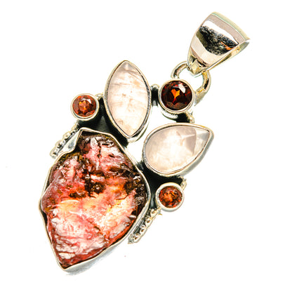 Rough garnet and rose quartz pendant with marbled teardrop center, pink drops, round dark red stones