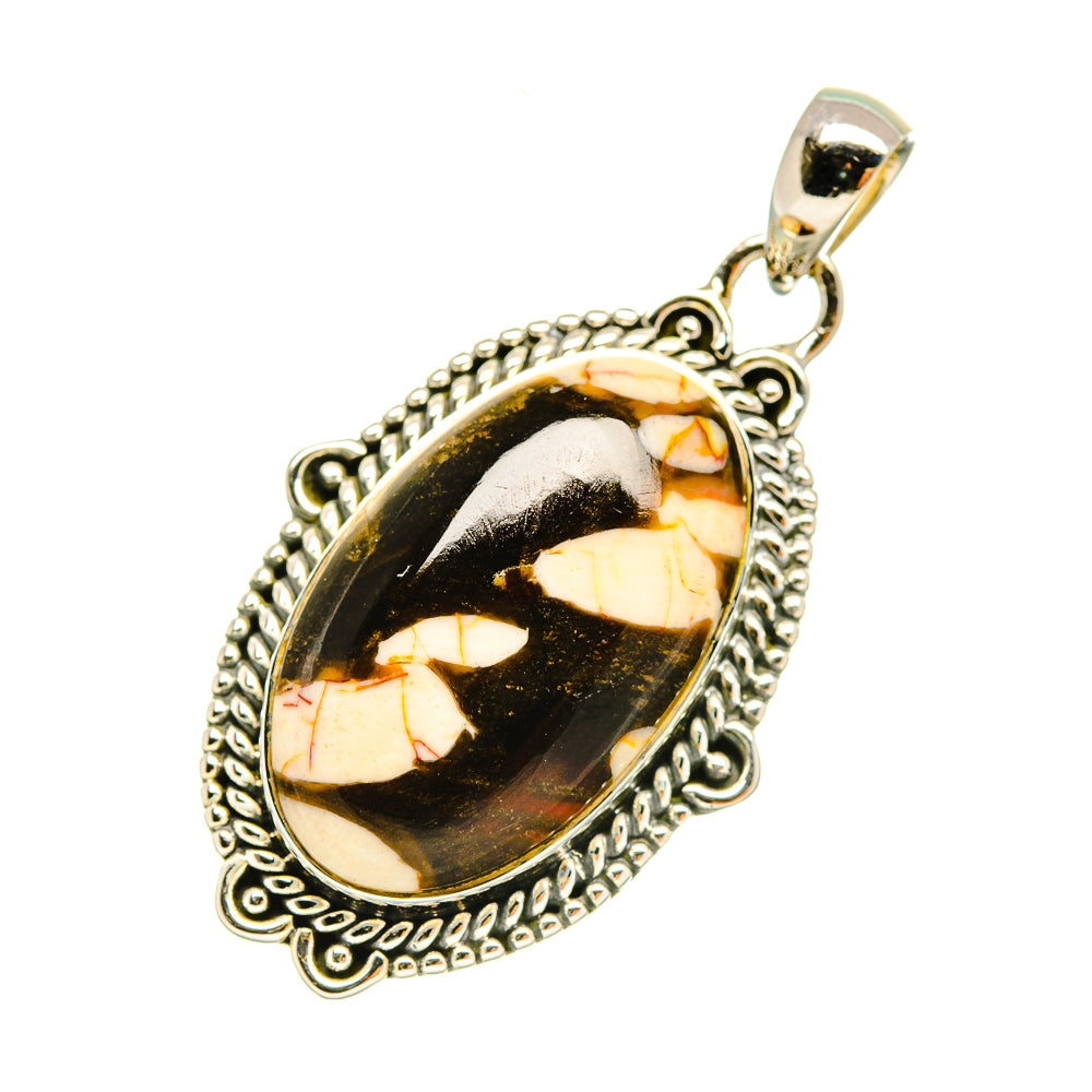 Oval jasper pendant with black-and-tan marbled stone and ornate silver border, loop top