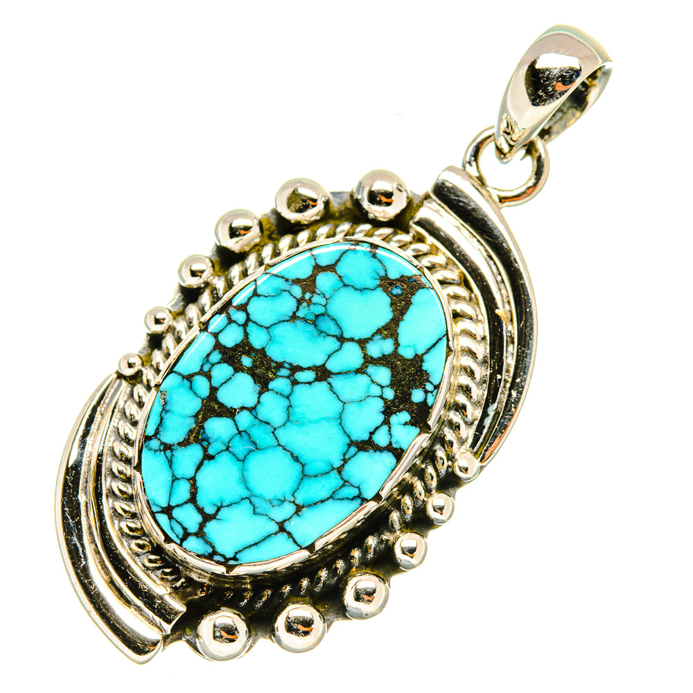 Turquoise oval pendant with sterling silver rim, bead accents, and top loop