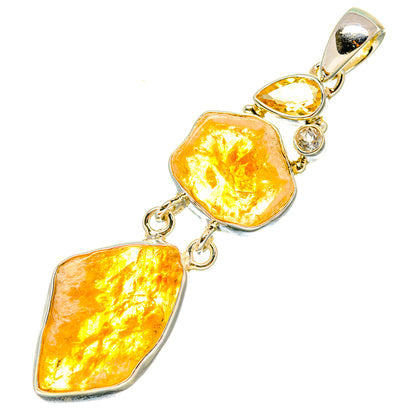 Rough citrine pendant with polished bail and sterling silver chain, three yellow stones