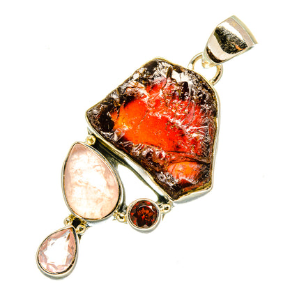 Sterling silver pendant with rough orange-red stone center and pink teardrop stones