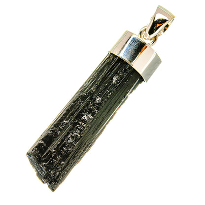 Tektite pendant with black tektite stone in 925 silver frame and bail, angled view.