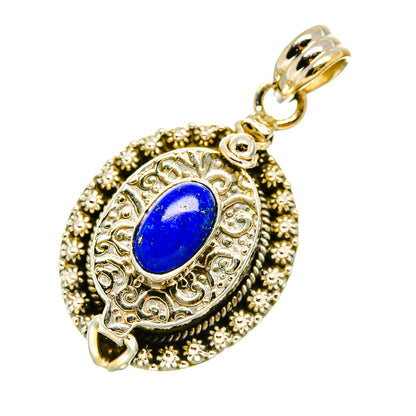 Lapis lazuli oval pendant with engraved filigree border, beaded edge, and silver bail