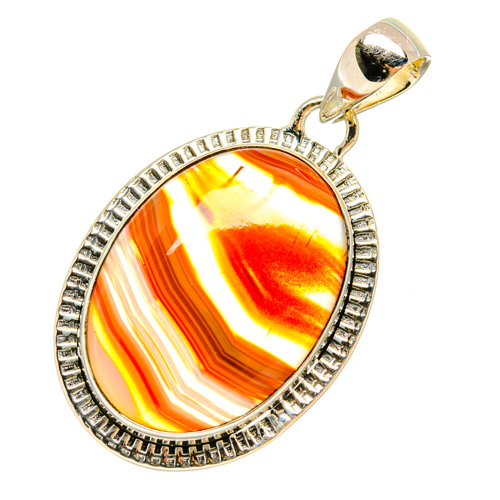 Oval orange Botswana agate pendant with sterling silver bezel, side loop bail