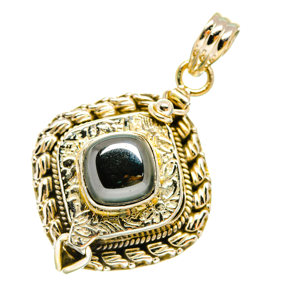 Sterling silver hematite pendant with dark oval cabochon and ornate frame, loop bail