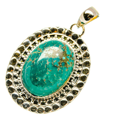 Oval turquoise cabochon pendant with ornate 925 sterling silver surround and bail
