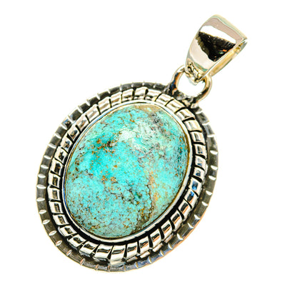Oval turquoise pendant with detailed silver frame and hooked bail, sterling silver.