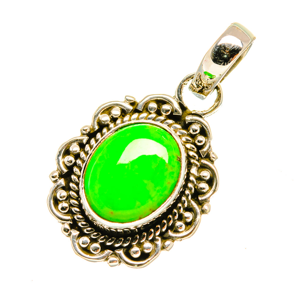 Green oval turquoise pendant with ornate silver-tone border and top bail loop