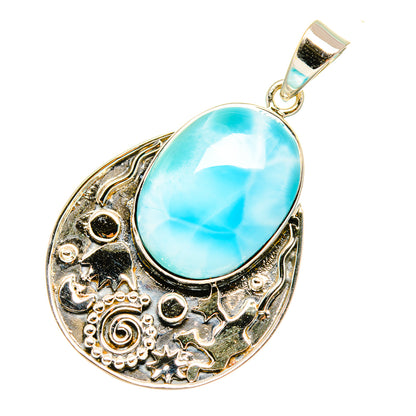 Larimar oval pendant in ornate silver setting, hanging on silver bail