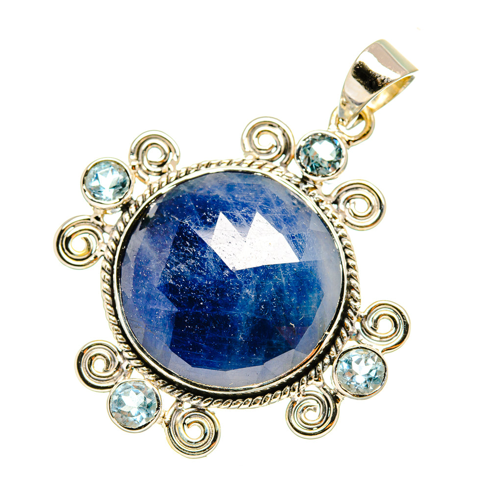 Round blue gemstone pendant with sterling silver scroll setting and clear blue side stones